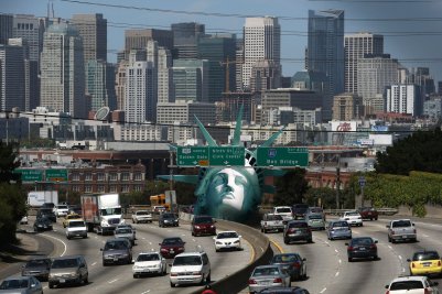 A replica of Lady Liberty's head was hoisted onto a San Francisco freeway Monday to protest American energy policy. (Thibaud Baiguini) 