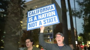 A protestor marches in favor of California seceding from the Union. 
